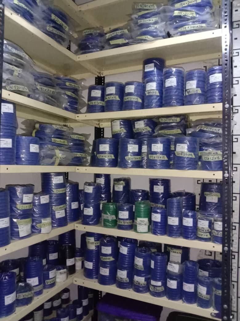 Blue hydraulic seals stacked on shelves